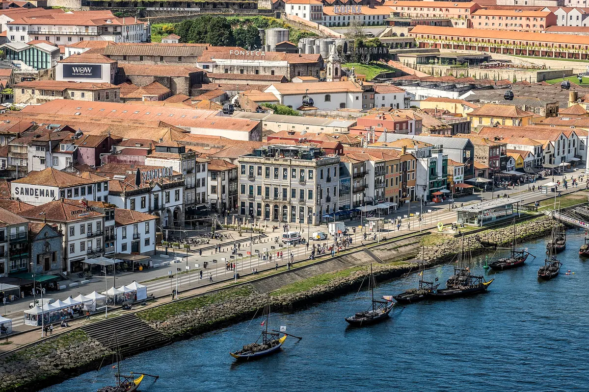 Rooftops and riverside quay of Ribeira seen from above, with boats on the Douro